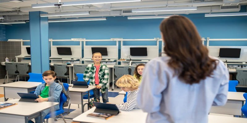 Computer lab classroom with exposed ceiling ducts